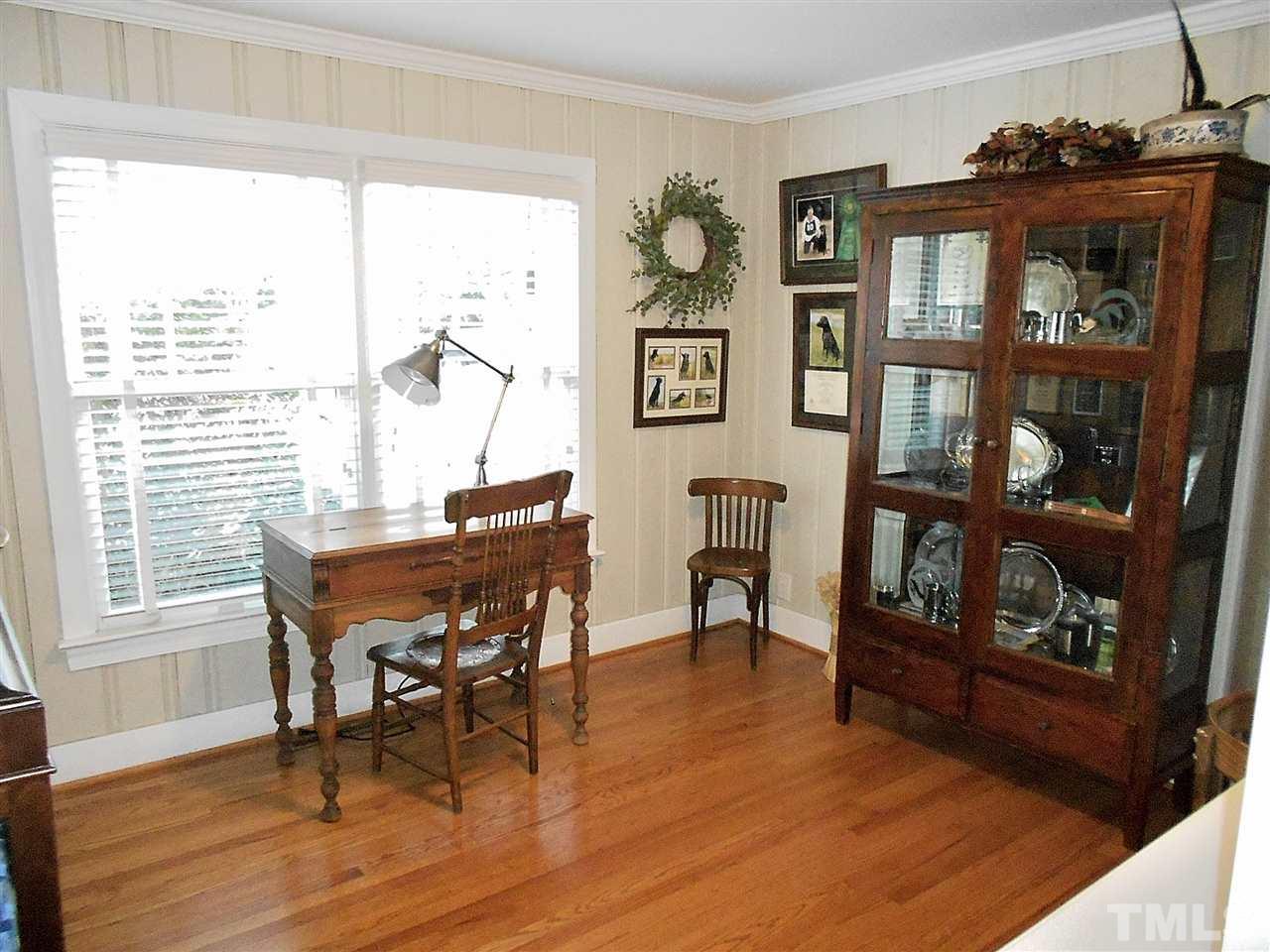 309 Forsyth Street Raleigh, NC 27609 - Photo 14 of 25 a dining room with furniture and wooden floor