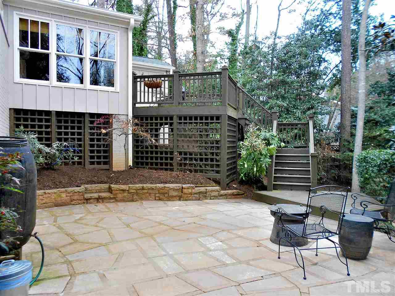 309 Forsyth Street Raleigh, NC 27609 - Photo 5 of 25 a view of house with backyard outdoor seating and plants