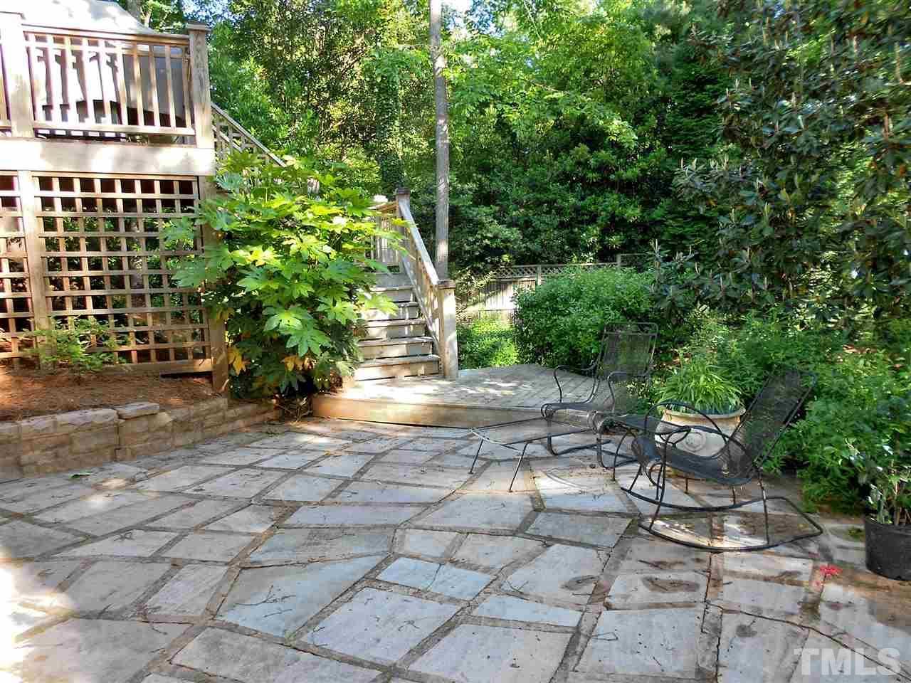 309 Forsyth Street Raleigh, NC 27609 - Photo 6 of 25 a view of a chairs and bench in a backyard