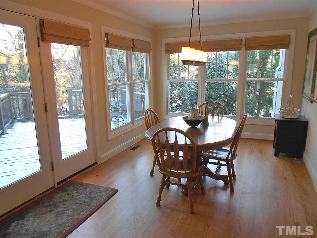 309 Forsyth Street Raleigh, NC 27609 - Photo 9 of 25 a dining room with furniture window wooden floor