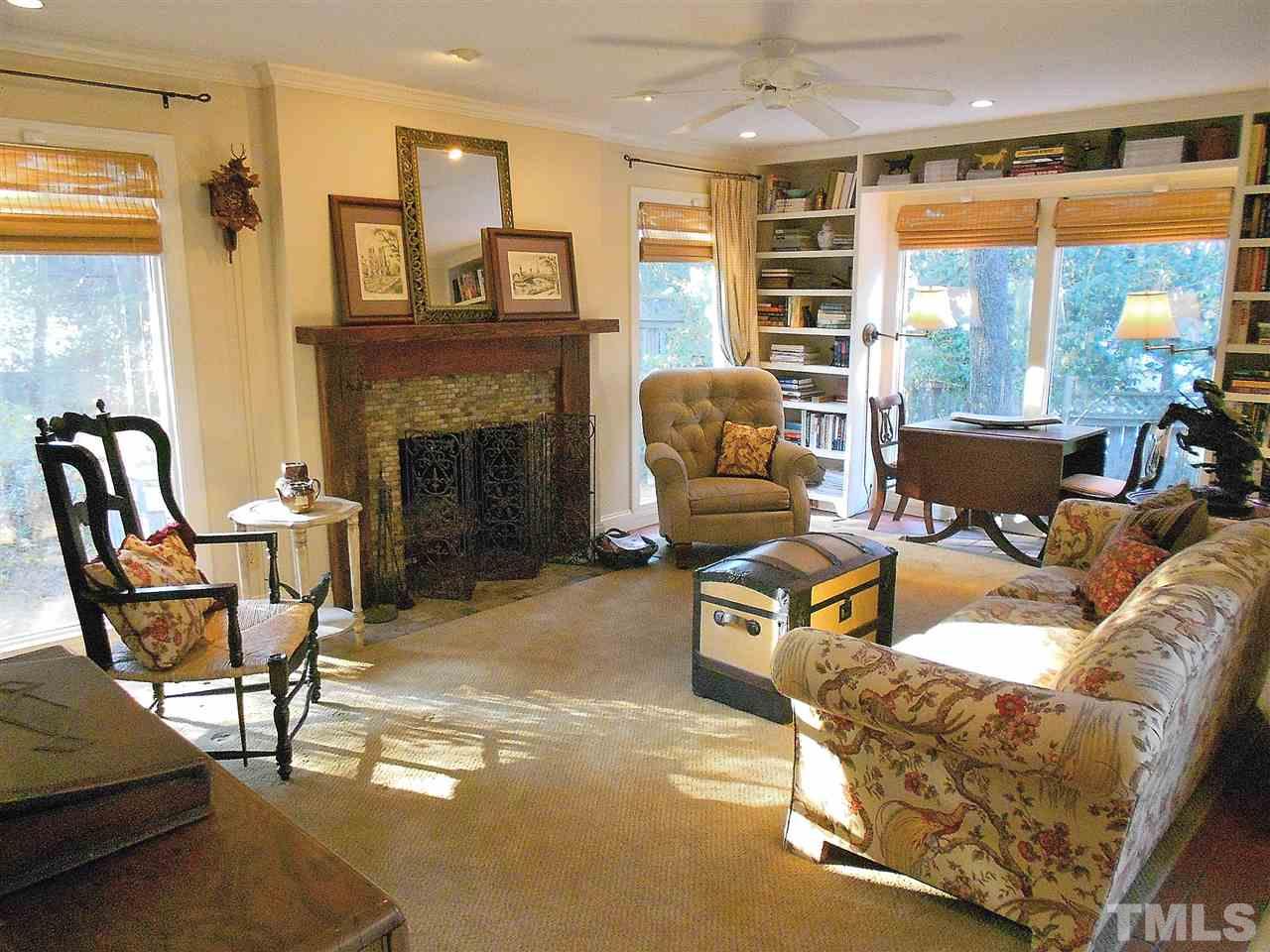 309 Forsyth Street Raleigh, NC 27609 - Photo 10 of 25 a living room with furniture and a fireplace