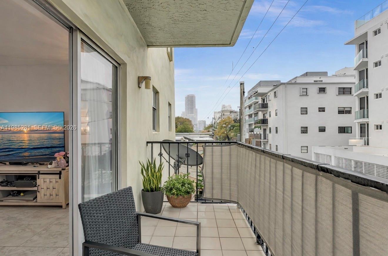 1236 Alton Road, Unit 304 Miami Beach, FL 33139 - Photo 5 of 28 a view of balcony with potted plants