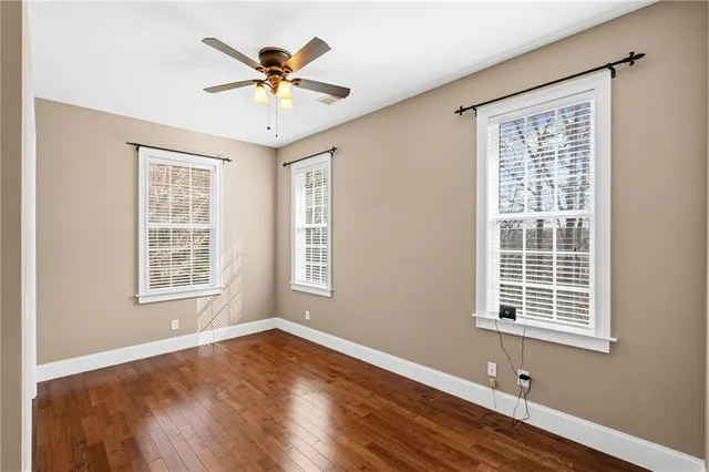 a kitchen with kitchen island granite countertop wooden cabinets and stainless steel appliances