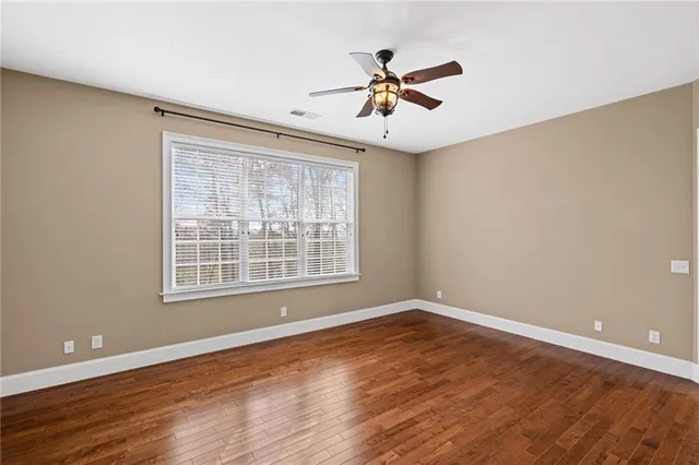 a bathroom with a sink a vanity and a large mirror