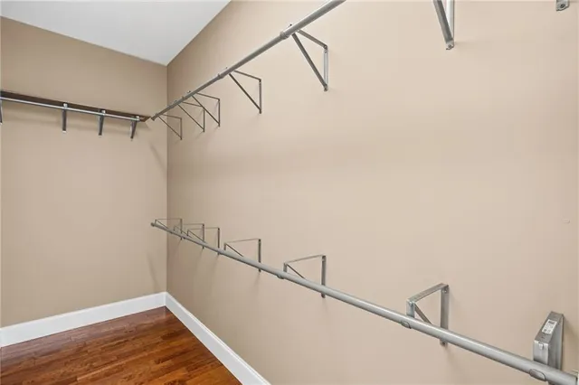 a bathroom with a sink vanity granite and toilet