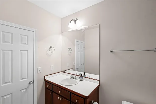 a view of an empty room with a ceiling fan