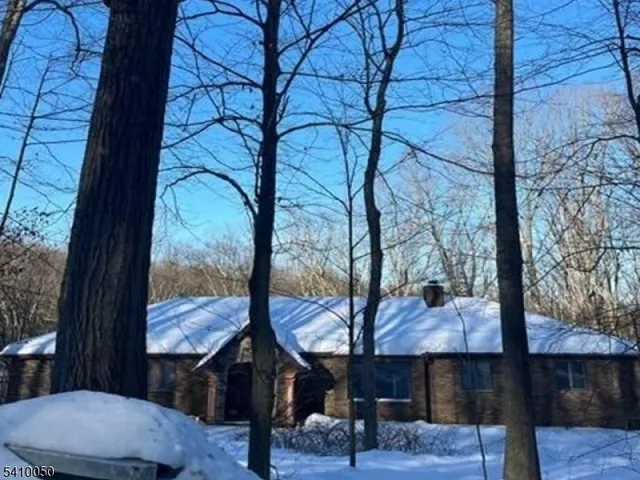 a view of a couches and a table in the balcony