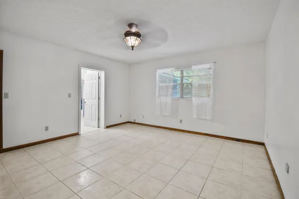 wooden floor in an empty room with a fireplace