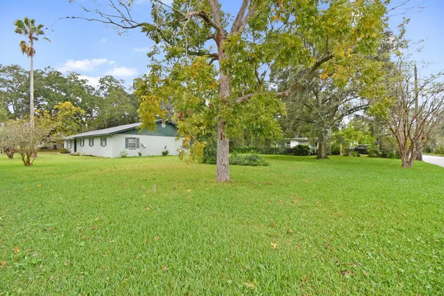 a house with trees in the background