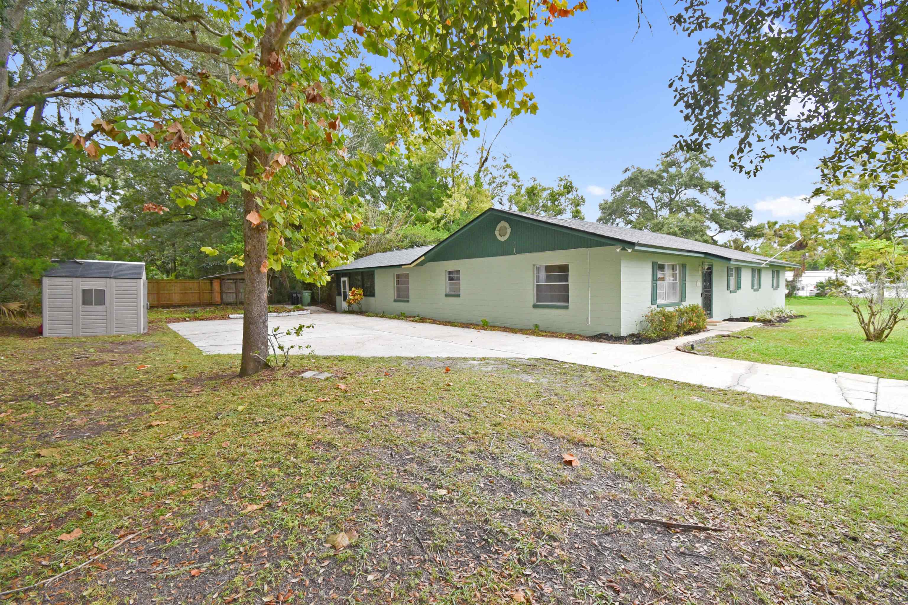 200 Theodore Street St. Augustine, FL 32084 - Photo 22 of 22 a house with trees in the background