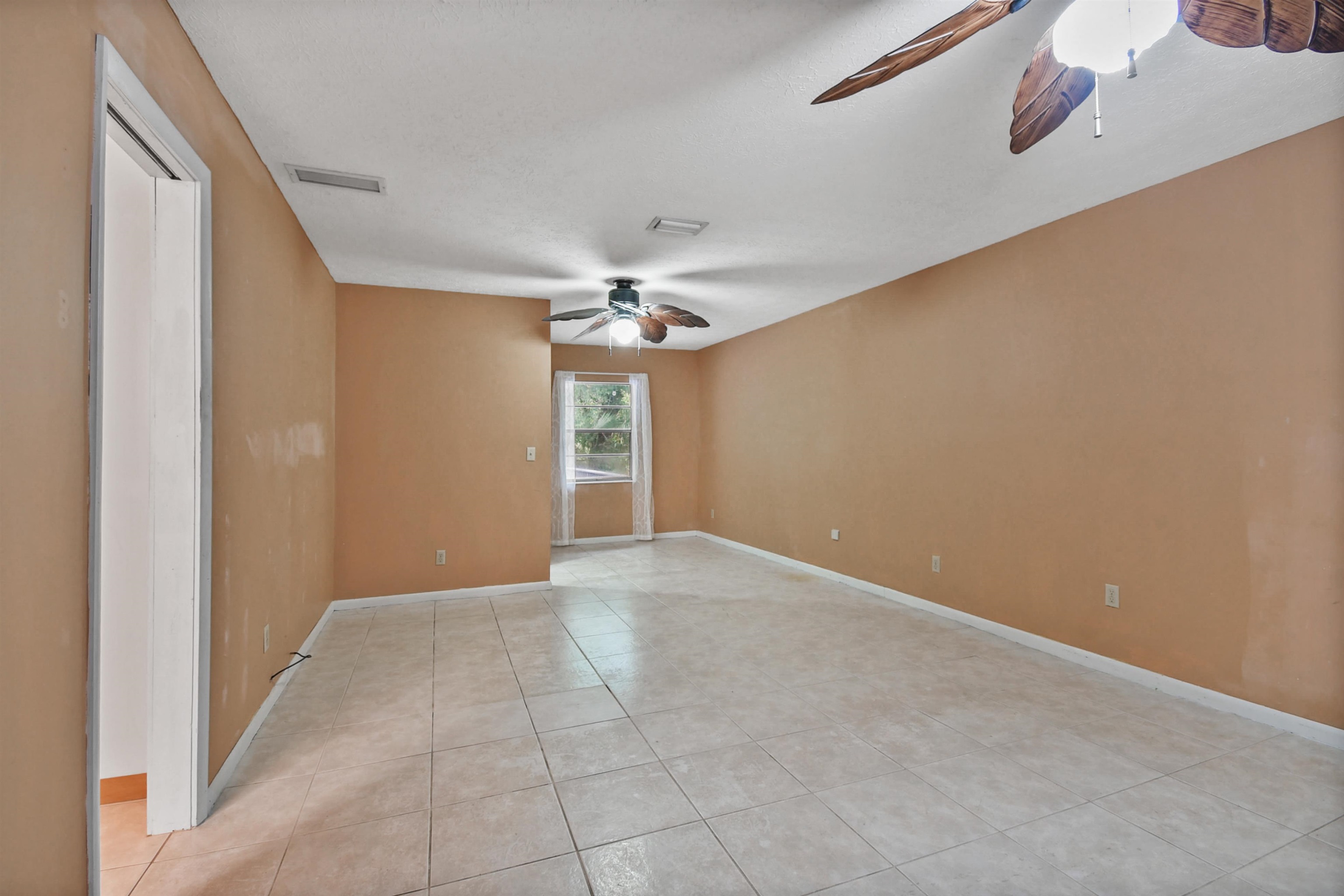 200 Theodore Street St. Augustine, FL 32084 - Photo 7 of 22 a view of an empty room with a chandelier