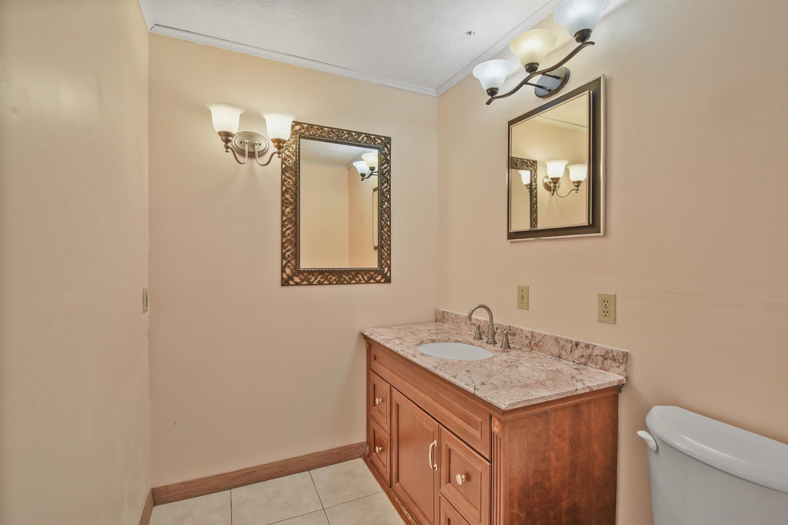 200 Theodore Street St. Augustine, FL 32084 - Photo 9 of 22 a bathroom with a sink and a mirror