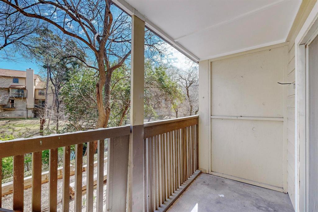 4845 Cedar Springs Road, Unit 164 Dallas, TX 75219 - Photo 9 of 14 a view of a balcony with wooden fence