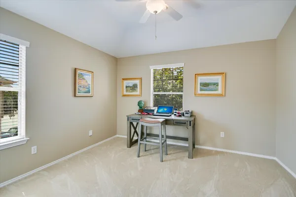 a work room with furniture and windows