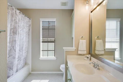 a bathroom with a bathtub and a sink