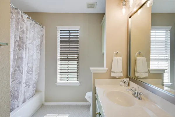 a bathroom with a bathtub and a sink