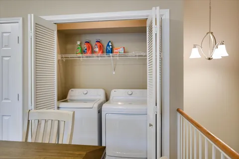 a view of storage and utility room with washer and dryer