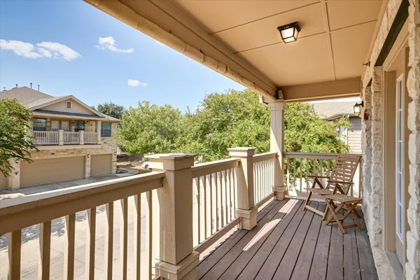 a view of a balcony with wooden floor
