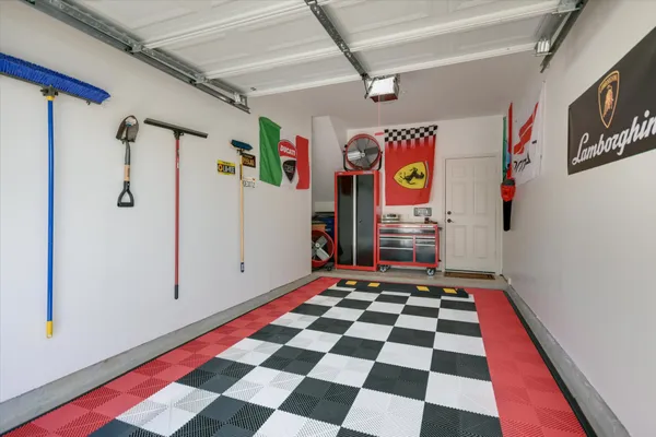 a area with stainless steel appliances and rug