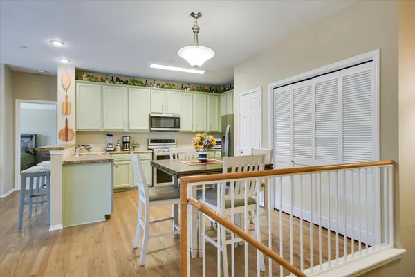 a kitchen with a stove a sink and a refrigerator
