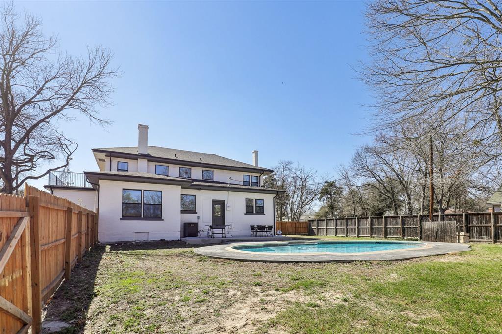 702 Griffith Avenue Terrell, TX 75160 - Photo 36 of 40 Rear view of house featuring a patio, a fenced backyard, and a chimney
