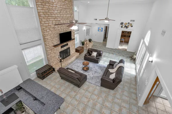 a living room with furniture and a fireplace