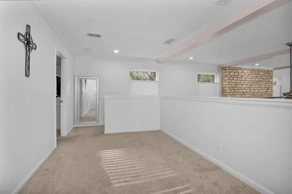 a view of hallway with a window and a kitchen