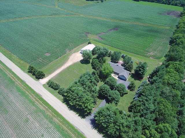 5835 East Canfield Road Chana, IL 61015 - Photo 3 of 35 a view of a garden with a building