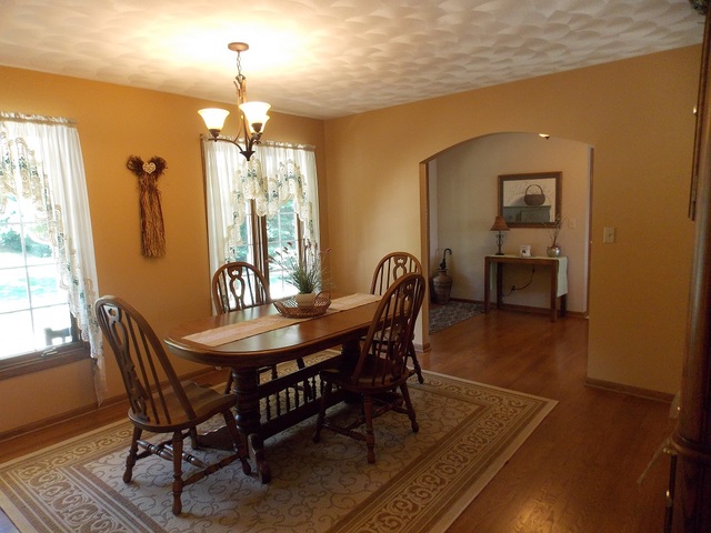 5835 East Canfield Road Chana, IL 61015 - Photo 7 of 35 a view of a a dining room with furniture window and wooden floor