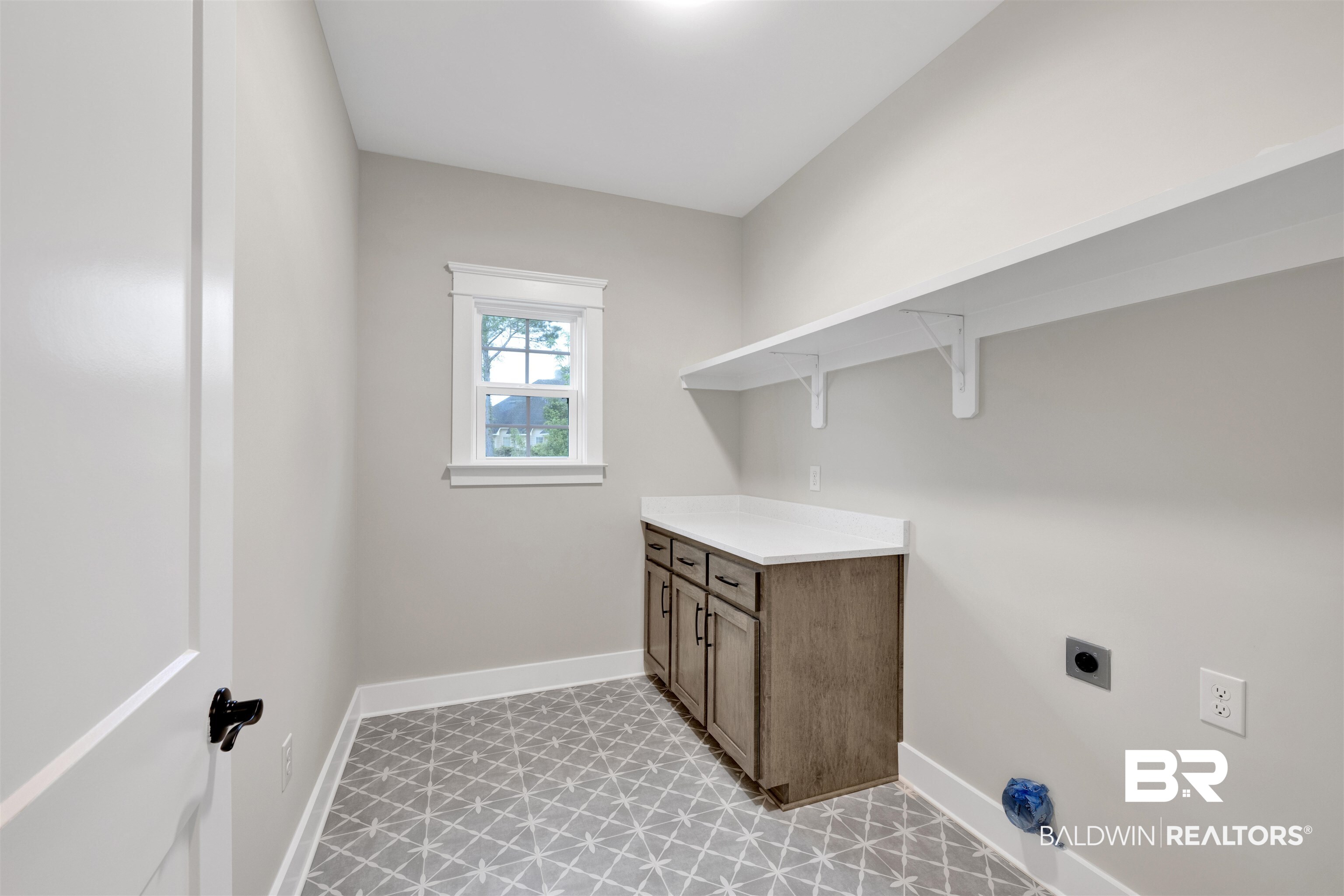 27382 Patch Pl Loop Daphne, AL 36526 - Photo 18 of 31 Laundry area with hookup for an electric dryer and cabinet space