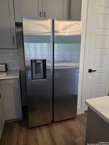 a stove top oven sitting inside of a kitchen