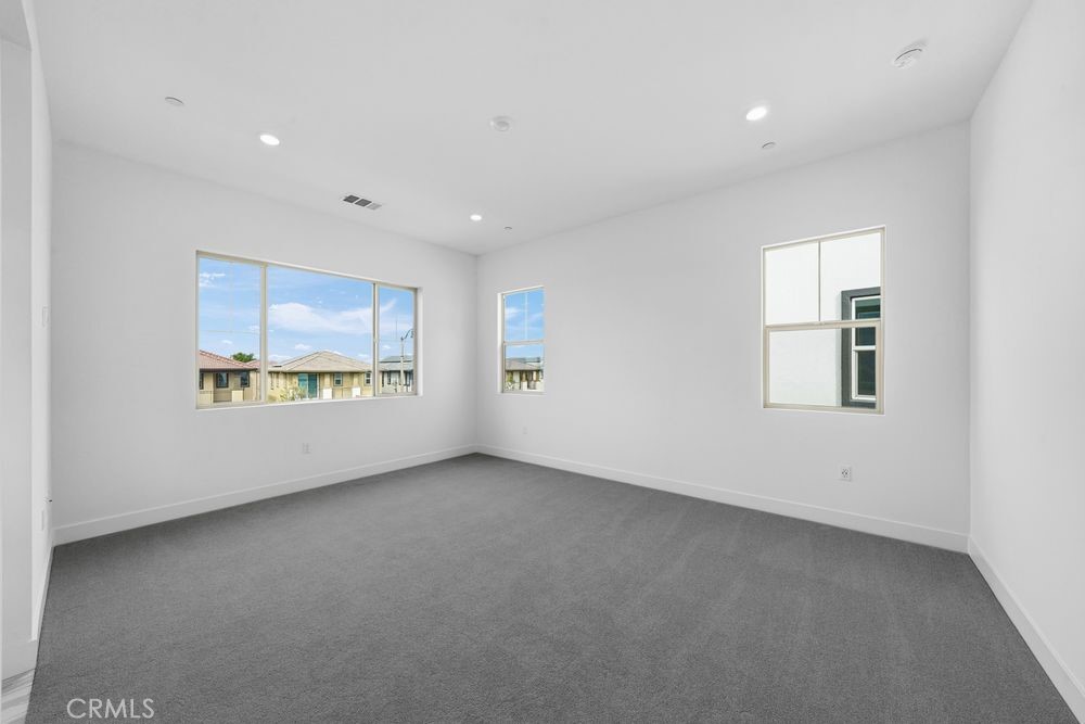 118 Pansy Irvine, CA 92618 - Photo 12 of 46 an empty room with a empty space and windows
