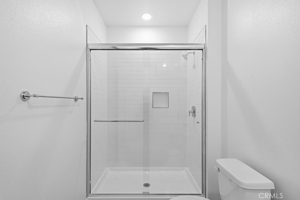 118 Pansy Irvine, CA 92618 - Photo 30 of 46 a bathroom with a shower a toilet and a window