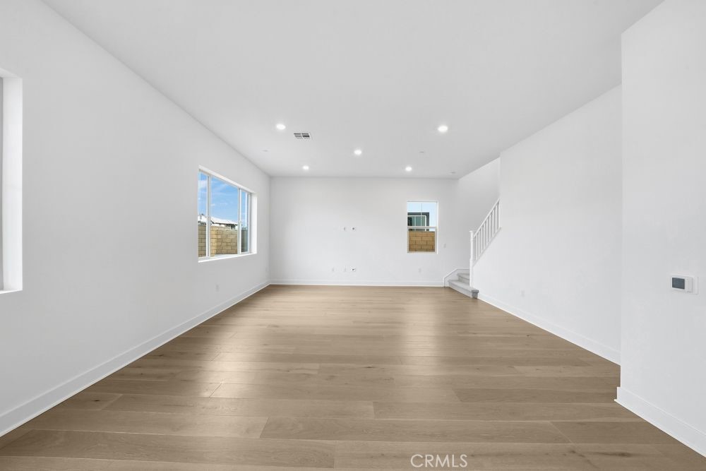 118 Pansy Irvine, CA 92618 - Photo 7 of 46 an empty room with wooden floor and windows