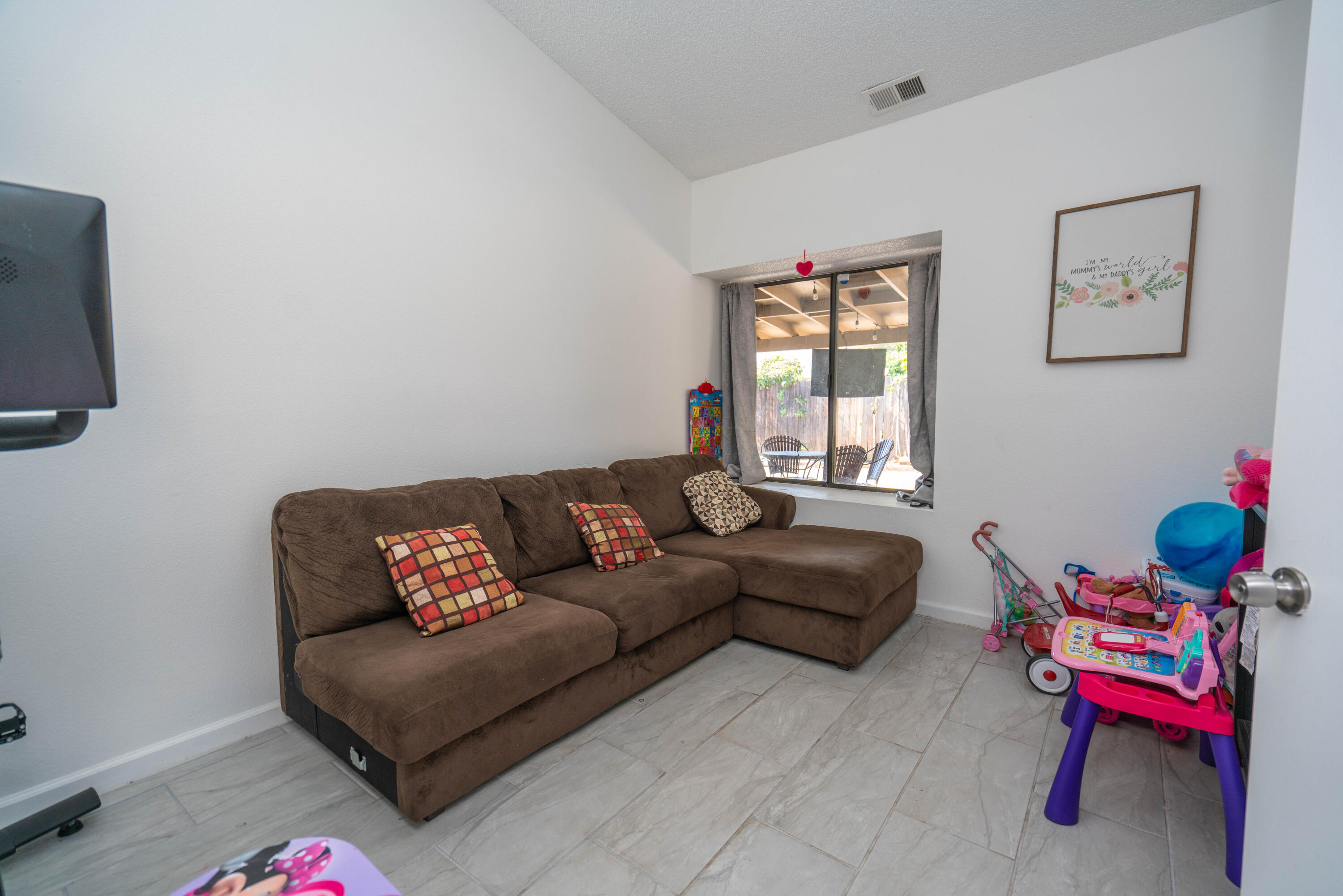 419 Quandt Ranch Road San Jacinto, CA 92583 - Photo 17 of 40 a living room with furniture and a window