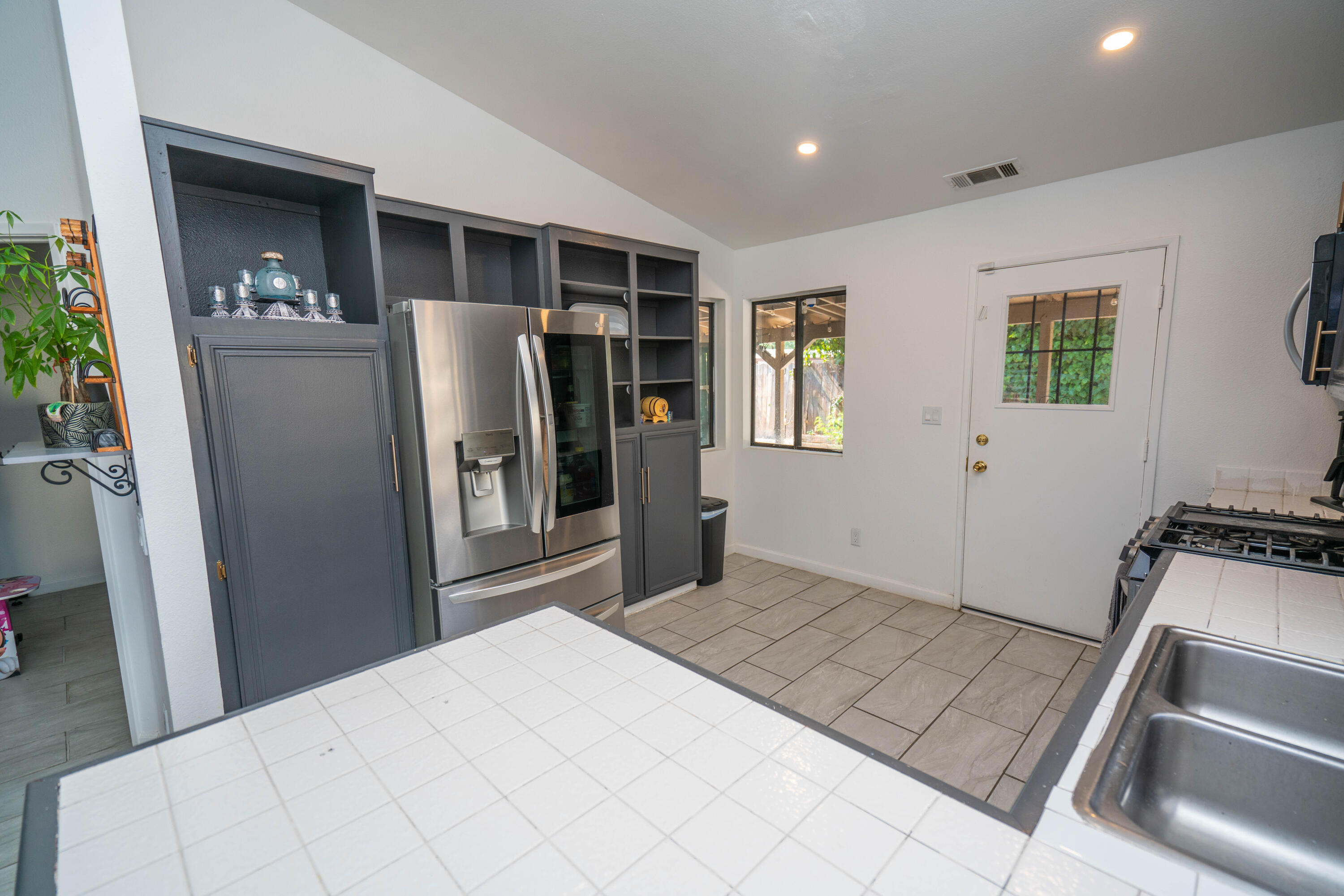 419 Quandt Ranch Road San Jacinto, CA 92583 - Photo 8 of 40 a kitchen with stainless steel appliances granite countertop a refrigerator and a stove