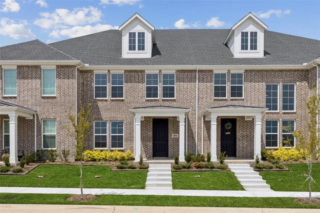 a front view of a house with yard