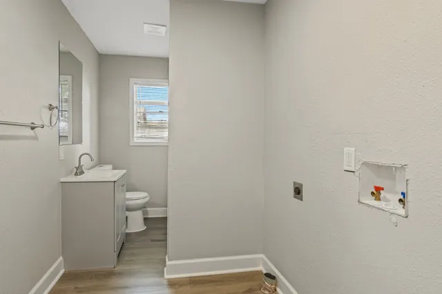 a bathroom with a toilet and a sink