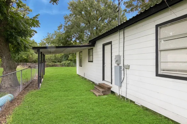 a view of a back yard with a swing