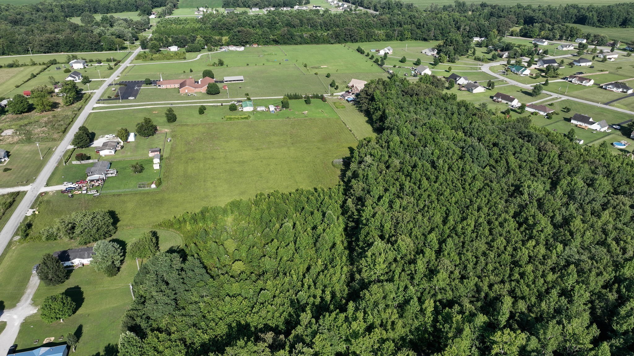 0 Ferrells Loop Road Manchester, TN 37355 - Photo 13 of 16 a view of a houses with a lush green forest