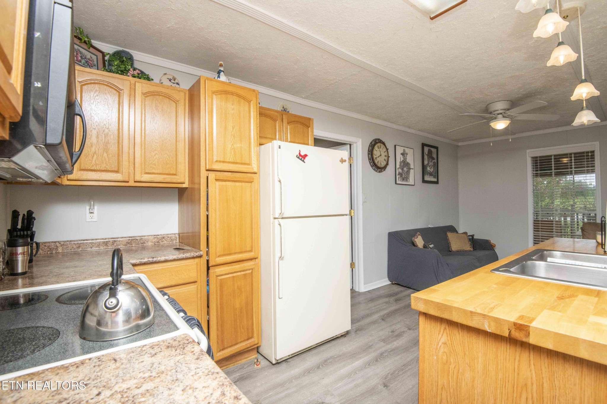 11981 South S Highway Crossville, TN 38572 - Photo 16 of 49 a kitchen with stainless steel appliances granite countertop a refrigerator a sink and a stove