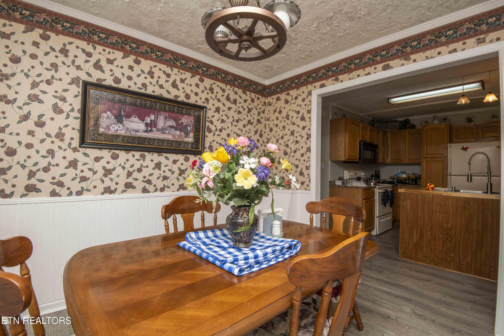 11981 South S Highway Crossville, TN 38572 - Photo 18 of 49 a view of a dining room with furniture and wooden floor