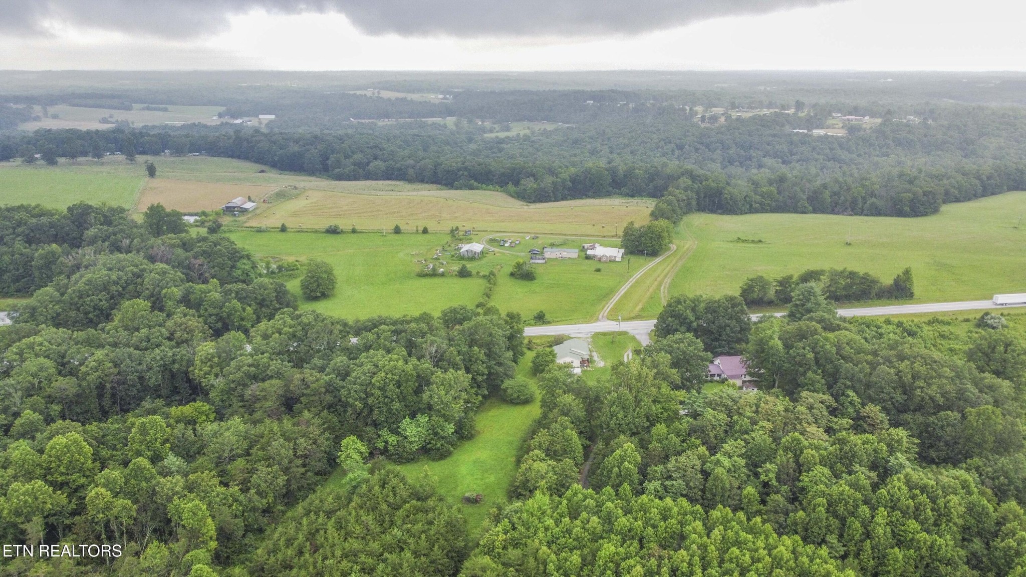 11981 South S Highway Crossville, TN 38572 - Photo 38 of 49 a view of a lake with a building in the back