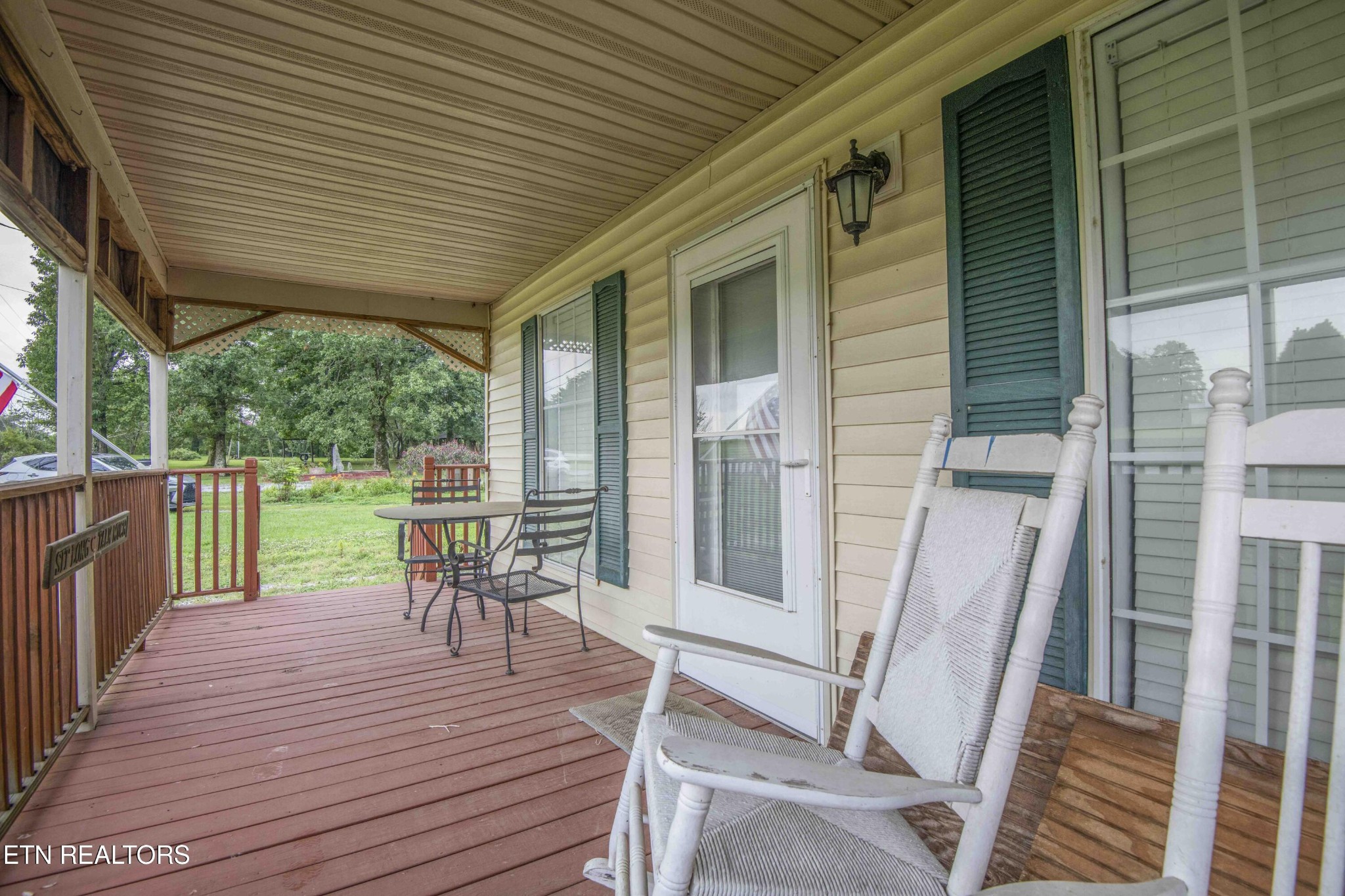 11981 South S Highway Crossville, TN 38572 - Photo 5 of 49 a view of a chairs and table on the wooden deck
