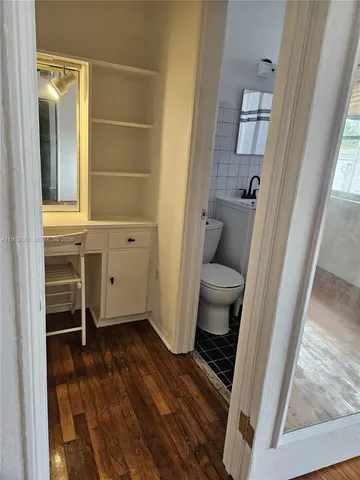a bathroom with a toilet and a sink