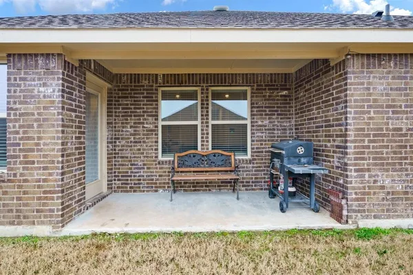a bench sitting in front of a building