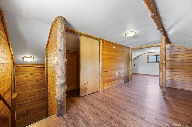 a view of front door with wooden floor