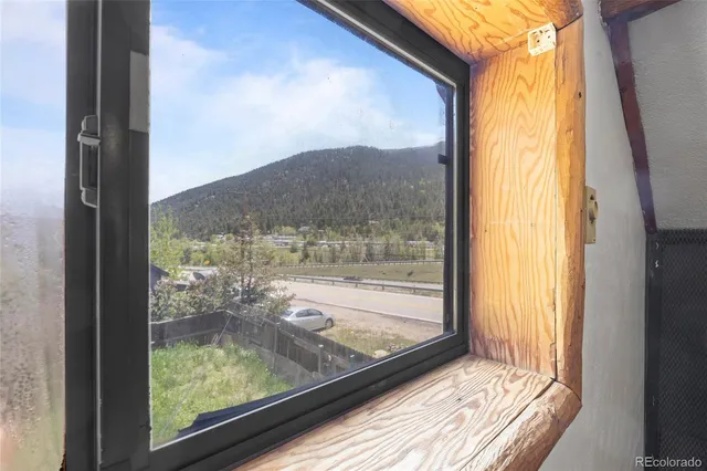 a view of a room with a large window