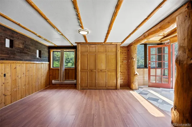 a view of entryway with wooden floor