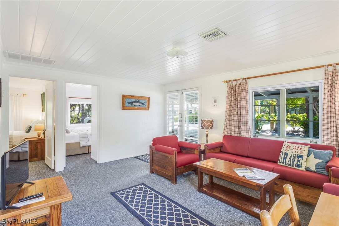 15107 Captiva Drive Captiva, FL 33924 - Photo 13 of 35 a living room with furniture and a window